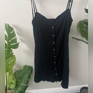 90s vibes with this ribbed summer mini with button from and tie straps